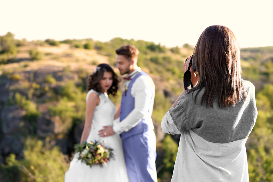 Photographer shooting a wedding couple