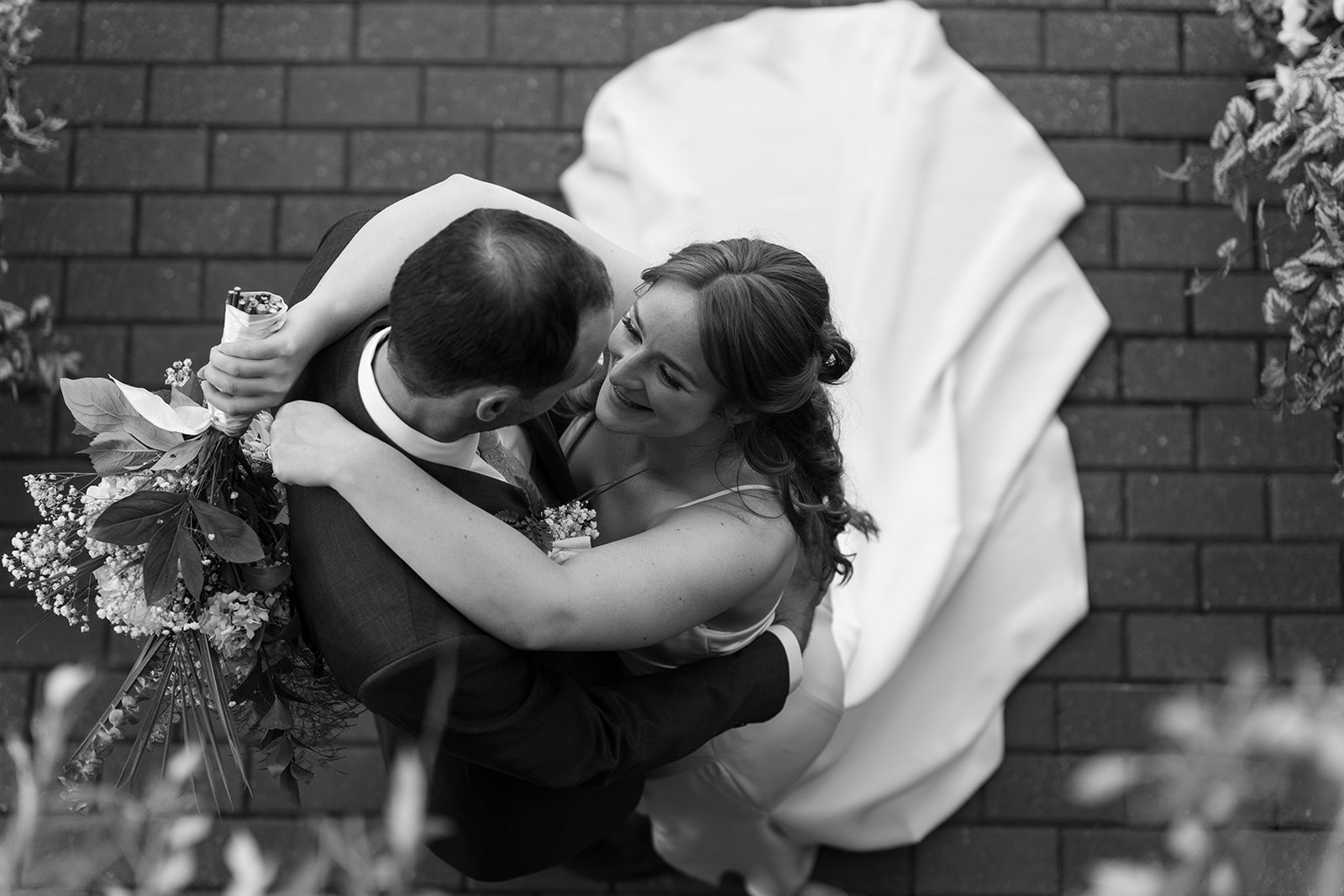 Bride and Groom dancing Black and white portrait from above